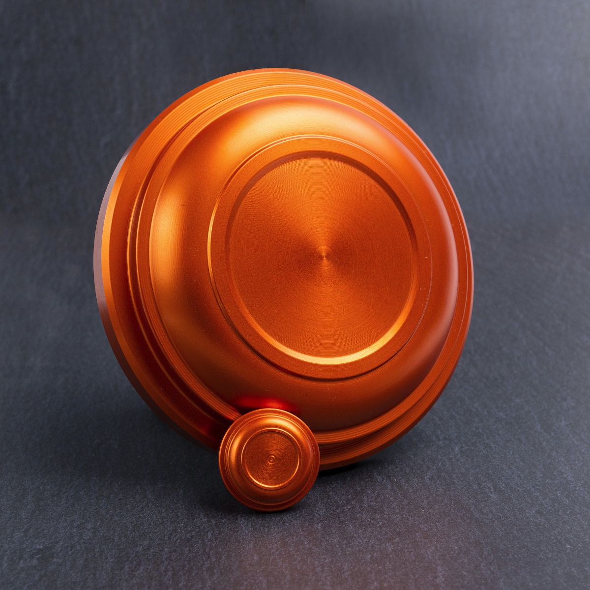 Clay bird machined from aluminum, anodized orange with miniature (sold separately)